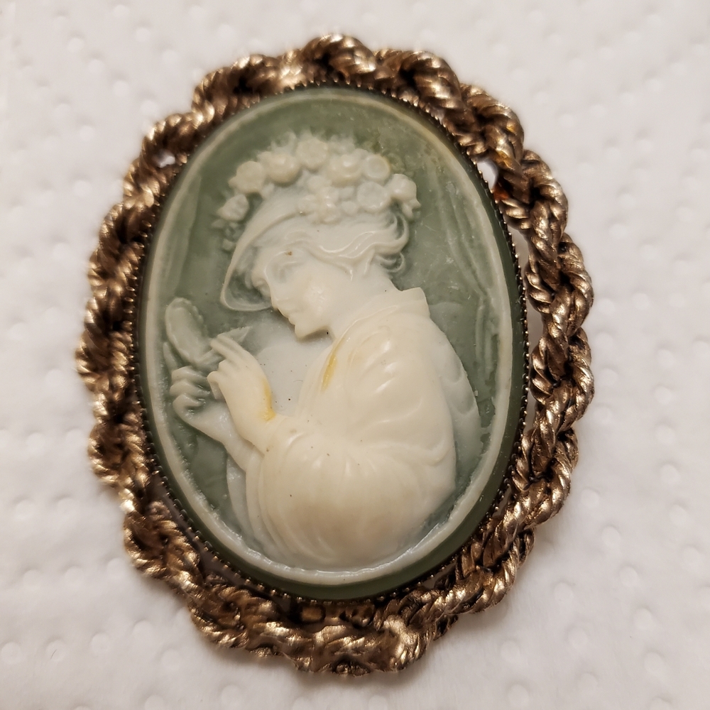 Cameo Brooch on green background with gold trim Vintage